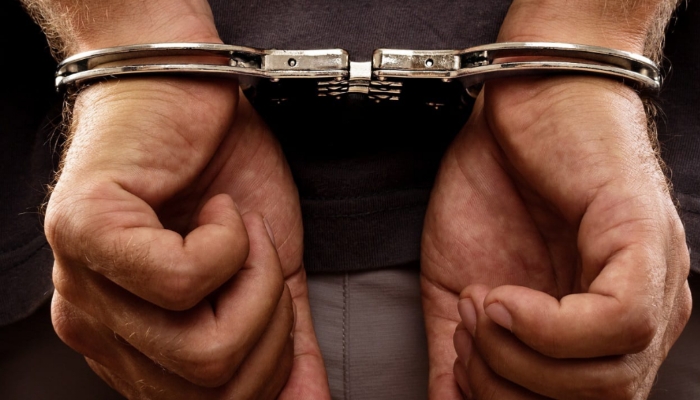 ILUSTRASI. Seorang tersangka digiring dengan tangan terborgol sebagai bagian dari proses penegakan hukum. (istimewa/ejaberita.co)